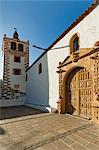 Door and belltower of the 17th century Santa Maria Cathedral in this historic former capital, Betancuria, Fuerteventura, Canary Islands, Spain, Europe