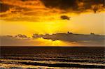 Sunset lighting the clouds offshore from this village on the north west coast, El Cotillo, Fuerteventura, Canary Islands, Spain, Atlantic, Europe