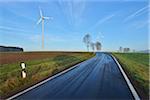 Country Road in Morning with Wind Turbines, Freiensteinau, Vogelsbergkreis, Hesse, Germany