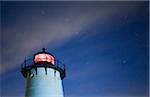 Top of the Edgartown Lighthouse in Edgartown, illuminated at night with star constellations and the 'Big Dipper' in the northern sky, Massachusetts, USA