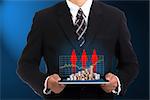 Businessman holding touch pad and growing finance for show case growing graph