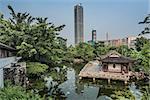 pagoda temple by pond at Kowloon Walled City Park in Hong Kong