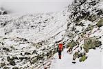 Alpinist climbing on mountain route up to peak in High Tatras. Slovakia. Poland. High Tatras