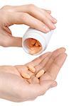 Putting pills from white jar on hand. Male hand holding out three pills  Isolated on white