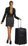 Businesswoman with wheeled travel bag makes step forward, back view. Isolated over white background