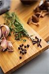 Closeup on pepper garlic and rosmarinus on cutting board