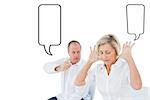 Older couple sitting in chairs arguing against speech bubble