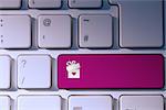 gift with heart against pink key on keyboard