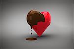 Heart dipped in chocolate against grey vignette