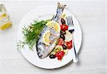 Sea bream with tomatoes and olives