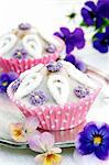 Cupcakes with sugar flowers and tufted pansies on a silver tray