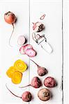 Beetroot and yellow beets, whole, sliced and peeled, with a peeler