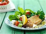 Pork escalope with a Mediterranean salad