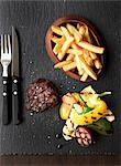 Grilled beef steak with chips and grilled vegetables