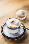 A cappuccino dusted with cocoa powder