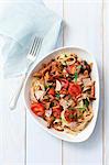 Tagliatelle with chanterelle mushrooms, ham and tomatoes