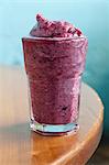 A blueberry and banana smoothie with apple juice