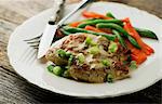 Chicken breast with mustard sauce, beans and carrots