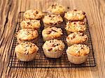 Apple muffins with hazelnuts on a wire rack