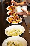 Dishes ready to be served on a counter in a restaurant