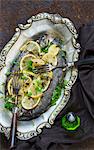 Fried trouts with lemons and parsley