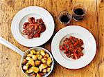 Piri-piri chicken with roast potaotes and wine (seen from above)