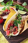 Tacos with minced meat, tomatoes and coriander (Mexico)