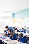 Teacher with his pupils in classroom