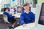 Primary school children working with computers