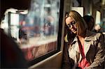 Businesswoman napping on train