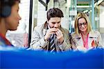 Business people eating on train