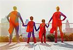 Superhero family standing on city rooftop