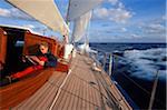 Man Relaxing in Cockpit of Endeavour during Offshore Passage between Bermuda and Antigua