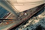 Man Trims Sails aboard Shamrock V while Sailing in Narragansett Bay, Newport, Rhode Island, USA