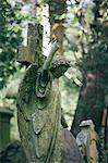 Statue of woman with red robin perched on an outstretched finger, Highgate Cemetery, London, England, United Kingdom, Europe