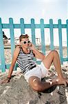 Teenager male beach summer holiday mobile phone