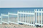 Blue wooden fence barrier beach Italy ocean