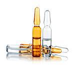 transparent and yellow medical ampoules on an isolated white background