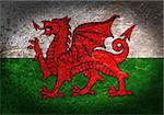 Old rusty metal sign with a flag - Wales