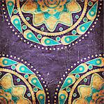 Abstract ornament of blue and yellow color on grunge violet background.