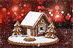 homenade holiday Gingerbread house with bokeh and snowflakes