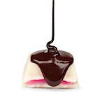 dark chocolate is poured onto a piece of white chocolate with pink stuffed stuffing