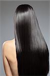 Woman with long straight shiny luxurious hair