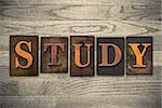 The word "STUDY" written in wooden letterpress type.