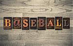 The word "BASEBALL" written in vintage wooden letterpress type.