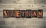 The word "VIETNAM" written in vintage wooden letterpress type.