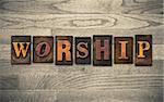 The word "WORSHIP" written in vintage wooden letterpress type.