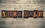 The words "YARD SALE" written in vintage wooden letterpress type.