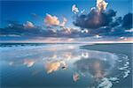 cloudscape reflected in North sea waves, Netherlands