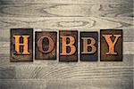 The word "HOBBY" written in vintage wooden letterpress type.